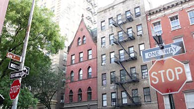New York City building architecture. Urban residential house exterior. Real estate. Red brick facade