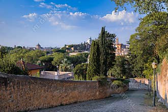 Rome cityscape: view from the Clivo di Rocca Savella, ancient street on Aventine Hill, Italy.
