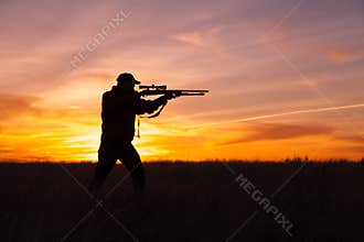 Rifle Hunter Shooting in Sunset