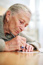 Senior woman writing