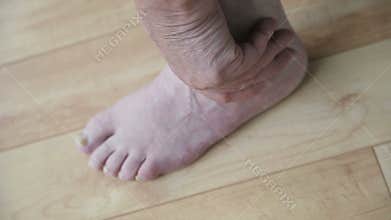 Man massaging his foot