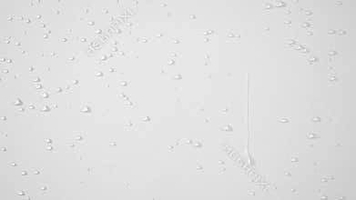 Water background with water movement, drops and splashes. Small streams of clear water flow down the white wall. Spa