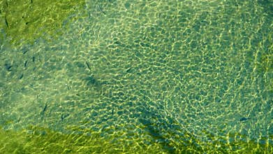 Small river view from above with clear water.