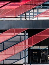 Red Staircase: Architectural Shadows and Light