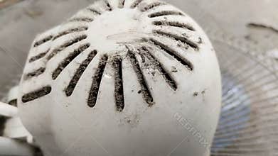 Dust that accumulates on the engine cover or fan