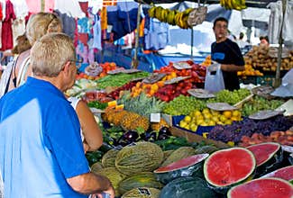 People shopping for Fruit and vegetables at market