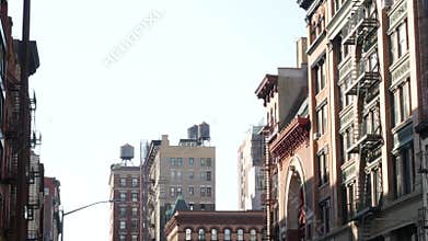New York City Manhattan architecture, USA. Residential house exterior. Red brick facade, water tower