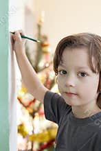 Boy draw on wall