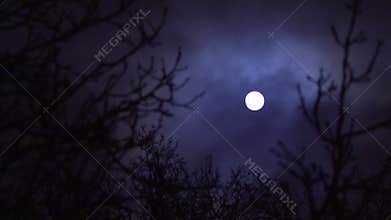 Clouds passing full moon