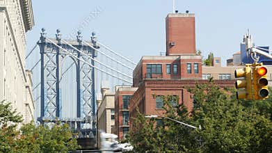 New York City Manhattan Bridge view from Brooklyn Bridge. Red brick residential building windows.