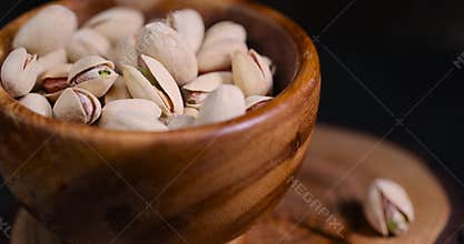 fried pistachio nuts in their shells with added salt