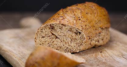 a healthy loaf of soft bread with added seeds and bran