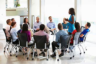 Businesswoman Addressing Multi-Cultural Office Staff Meeting
