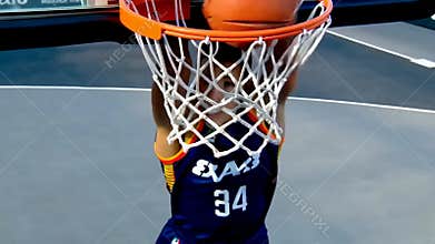 Basketball swishes through net scoring point hoop outdoor court closeup action stock footage Generative AI