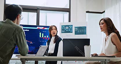 Asian generation z business people work together in home office. Financial team businesspeople brainstorm meeting