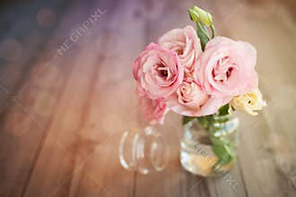Colorful still life with roses in glass vase