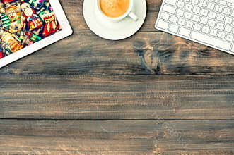 Tablet pc, keyboard and cup of coffee. workplace with christmas