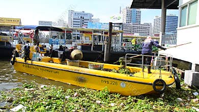 Vessel Municipal garbage collection cleaning Chao Phraya River at Bangkok