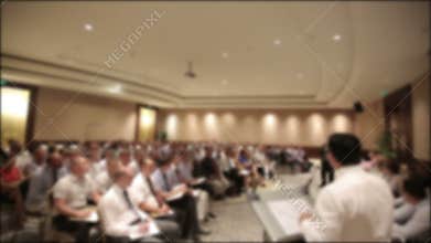 Many people came together at a conference or seminar. Blurred background