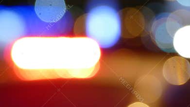 Police cruiser flashing siren lights