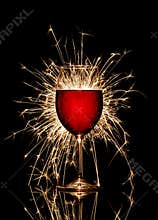Glowing red wine and firework