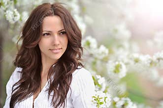 Spring beauty girl. Beautiful young woman in a summer park outdo