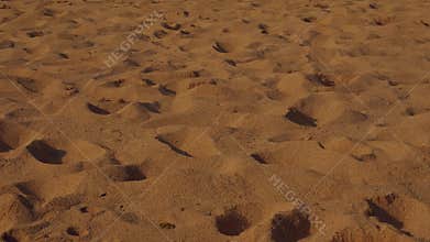 Close-up of human footprints on desert sand