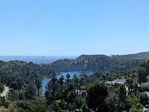 Hollywood, Los Angeles 2026.04.06. - View from Hollywood hills lookout with water reservoir and Los Angeles skyline in background