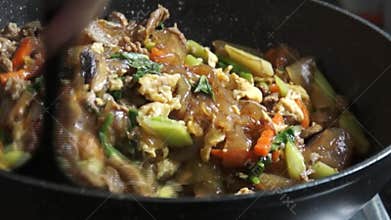 Thai Pad See Ew Stir-fried Flat Rice Noodles with Marinated Pork and Dark Soy Sauce on Home Stove