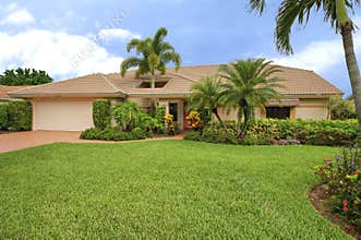 Florida clean ranch style home with roof hole to accomodate palm tree