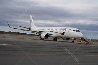 Amelia Embraer E190LR in Silversea Expeditions livery at the terminal gates in Punta Arenas airport
