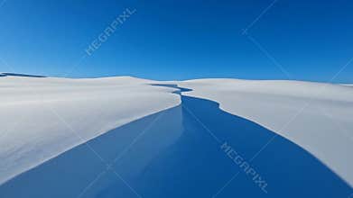Breathtaking aerial view of rolling white sand dunes desert under clear deep blue sky during bright day yard, nature concept