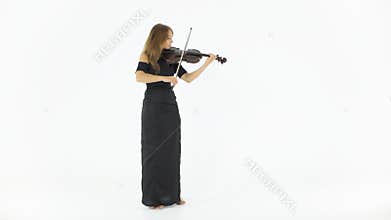 Girl in a long black dress playing the violin