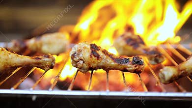 Grilled chicken BBQ cooked with a fire