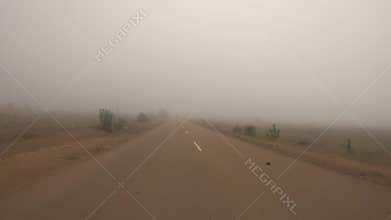 Fog on a Indian road. POV car trip