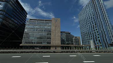 Amsterdam Zuid business district with modern glass office towers, reflective