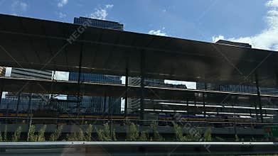 Modern Amsterdam Zuid businessdistrict with elevated railway platforms, office