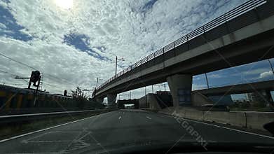 stationary highway underpass with elevated railway bridge in urban