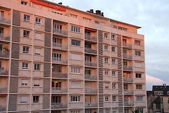 The sunset is illuminating the facade of a residential building (France)