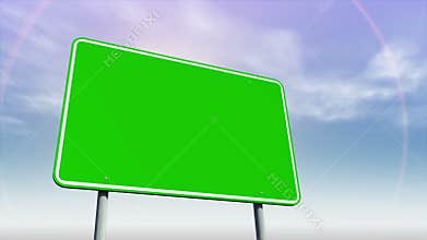 Empty green road sign against changing sky