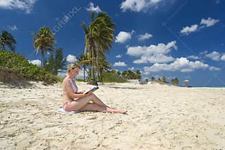Woman reading on beach