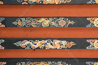A dragon, a phoenix and diverse patterns are painted on the ceiling of a temple (Bhutan)