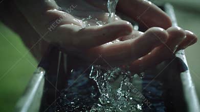 Slow Motion Water Over Hand