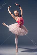 Portrait of the ballerina in ballet pose