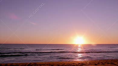 Sunset at Dunas Douradas beach seascape, destination in Algarve, Portugal.
