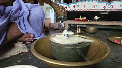 Shivling Abhishekam Ritual with Milk and Flowers, Hindu Worship Ceremony India