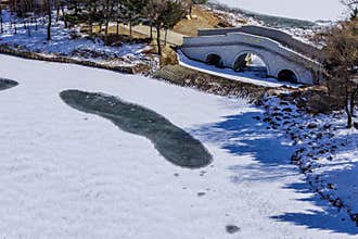 Early Spring Snow - Yulun Bridge Scenery in Jingyuetan National Forest Park, Changchun, China