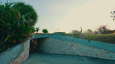 Entrance Tunnel to a Tropical Park at Sunset