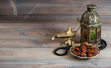 Dates, arabian lantern and rosary. Islamic holiday