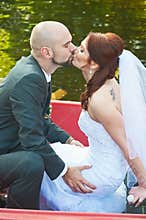 Groom kissing his bride